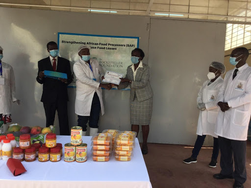 The Principal CAVS, Prof. Rose Nyikal and the Dean, FoA, Prof. Moses Nyangito awarding certificate of participation to the Kawala Group Trainees